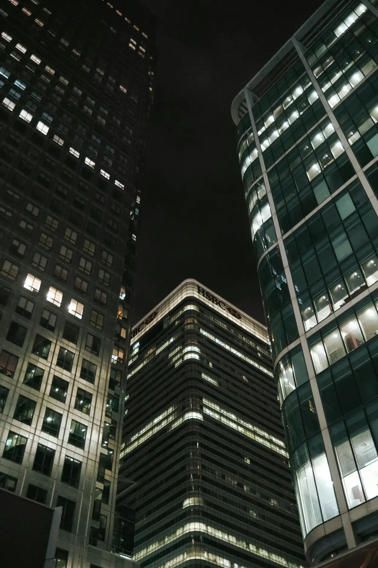 Canary Wharf office towers seen from below at night